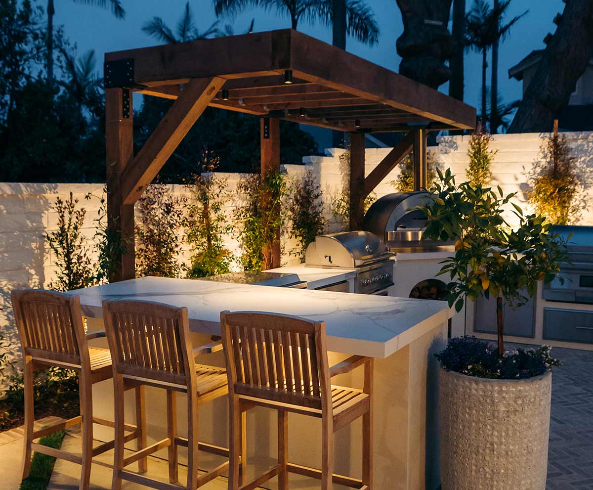 Outdoor kitchen lit up in the evening